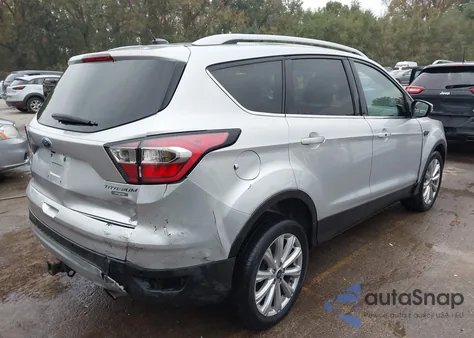 2017 Ford Escape Titanium z USA, uszkodzony, nr VIN 1FMCU0J90HUB80160